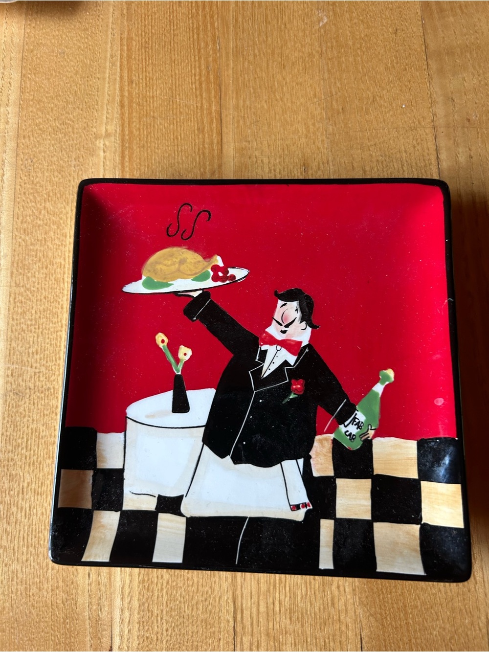 Fun Whimsical Server Illustration on a Ceramic Red and Black Plate